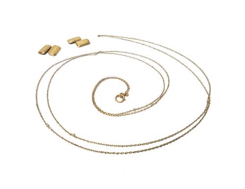 A gold and pearl long chain, in an oval link design, with a boltring clasp and a pair of 9ct gold cut cornered rectangular cufflinks decorated with en