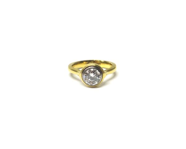 A  gold and diamond single stone ring, collet set with a circular cut diamond, detailed 18ct, ring size J, the diamond weighs approx 0.75 cts.