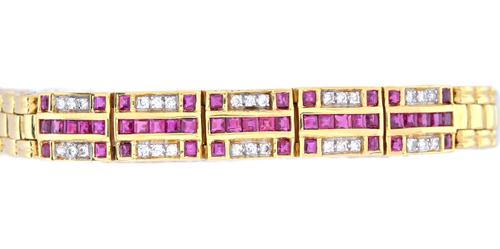 A gold, ruby and diamond bracelet, the front formed as five panels, each mounted with a row of calibre cut rubies to the centre, with two rows of thre