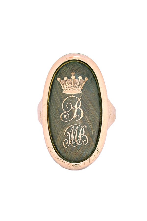 A George III gold mourning ring, glazed with an oval hair locket compartment and with a coronet surmounting an initial B, above the initials MB, detai