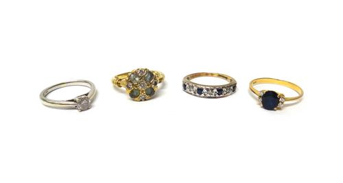 An 18ct gold, diamond and pale blue/green gem set cluster ring, gross weight 4.8 gms, a gold ring, claw set with an oval cut sapphire at the centre, b
