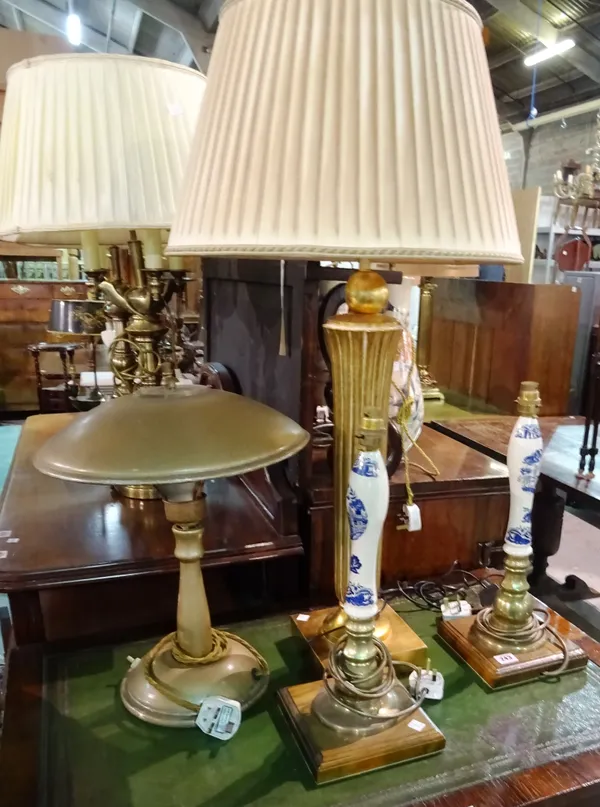 Table lamps, comprising; a large giltwood fluted table lamp, a pair of table lamps formed from beer pumps and a patinated metal table lamp, (4).  F6
