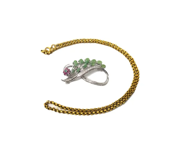 A gold, diamond, ruby and green gem set brooch, designed as a spray, detailed 750 and a gold circular link neckchain, detailed 9 CT, on a boltring cla