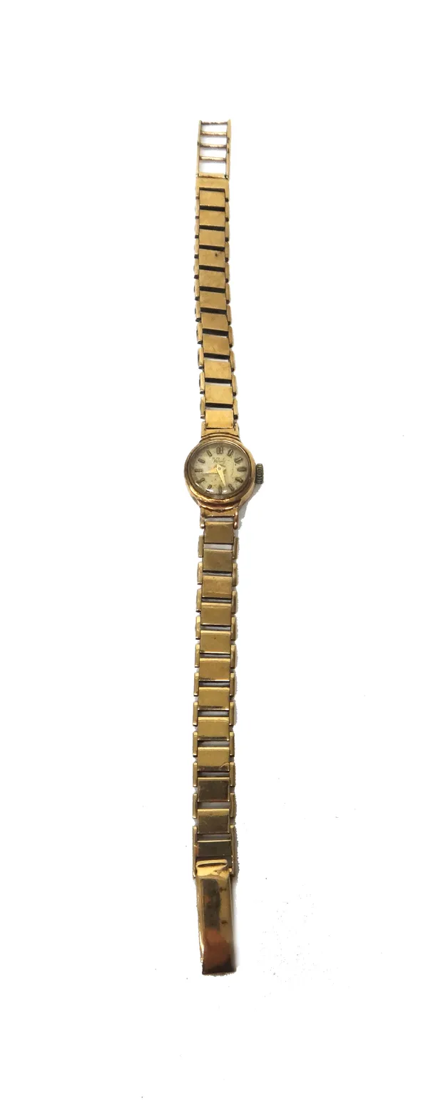 A Verity 9ct gold cased lady's bracelet wristwatch, the signed circular silvered dial with baton shaped numerals, the 9ct gold bracelet with a foldove