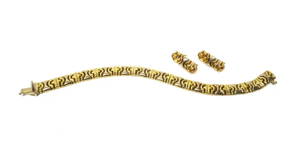 A two colour gold bracelet, on a snap clasp, detailed 750 Italy and a pair of earrings in a matching design, the backs with gold post and gilt metal f