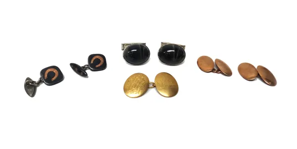 A pair of 9ct gold oval cufflinks, of plain dished form, Birmingham 1912, weight 6.3 gms, a pair of niello decorated cufflinks, with horseshoe motifs