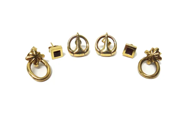 A pair of 9ct gold earrings, each in a loop shaped design, a pair of gold and red gem set single stone earstuds and a pair of gold earstuds in an oval