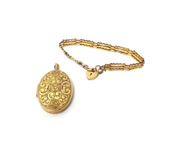A 9ct gold oval pendant locket, with floral and scroll engraved decoration and a 9ct gold gatelink bracelet, with a heart shaped padlock clasp, gross