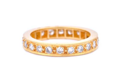 An 18ct yellow gold and diamond set full eternity ring, mounted with circular cut diamonds, ring size P Illustrated.