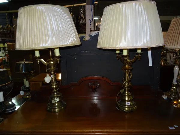 A pair of 20th century brass three light table lamps with turned columns, (2).  G6
