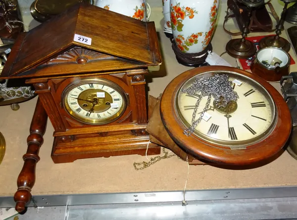 An early 20th century  Winterhalder and Hofmeier German oak metal clock and a postman's alarm wall clock, (2).  S2