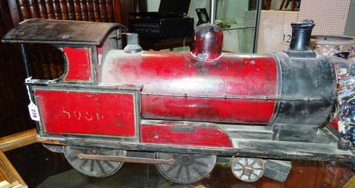 A scratch built wooden model of a train, early/mid 20th century, 'Gordon', with partial red livery, 72cm long.   D5