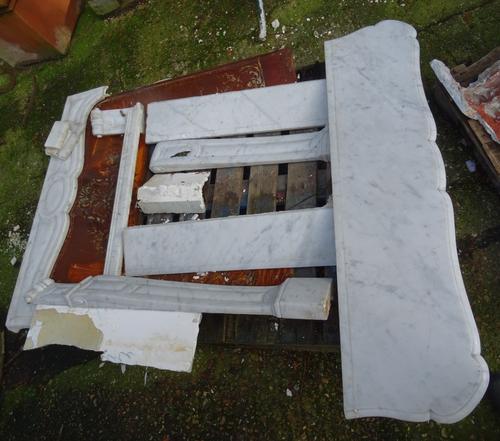 A Victorian cast iron fire place with white marble surround, 102cm wide x 109cm high.  OUT