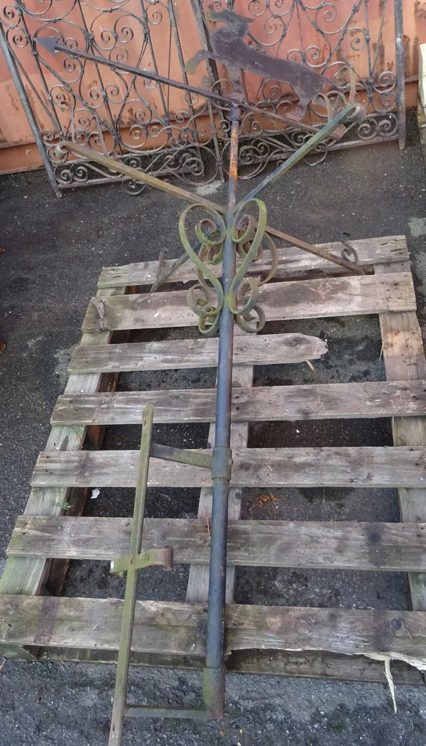 An early 20th century cast iron weather vane in the style of a horse, 109cm wide x 213cm high.  OUT