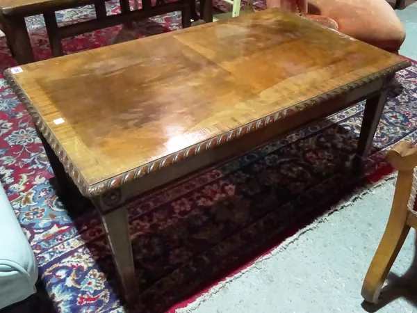 A 20th century mahogany rectangular coffee table on tapering square supports, 90cm wide.  J5