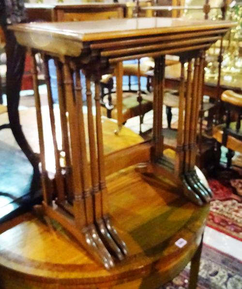 A nest of four Regency style mahogany occasional tables, on turned supports united by concave stretcher, the largest 58cm wide.  1174 G7