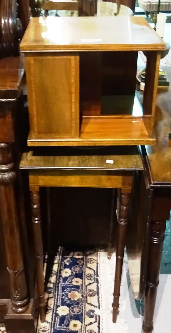 An Edwardian inlaid mahogany square table top revolving bookcase, 36cm wide and a mahogany square occasional table, on turned supports, 43cm wide, (2)