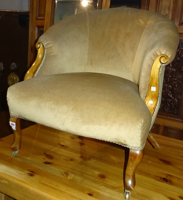 A late Victorian stained beech tub back easy armchair, on cabriole supports, 70cm wide.  1114  J8