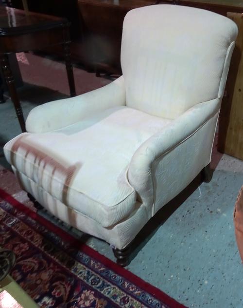 A Victorian mahogany framed easy armchair on turned supports.  K5
