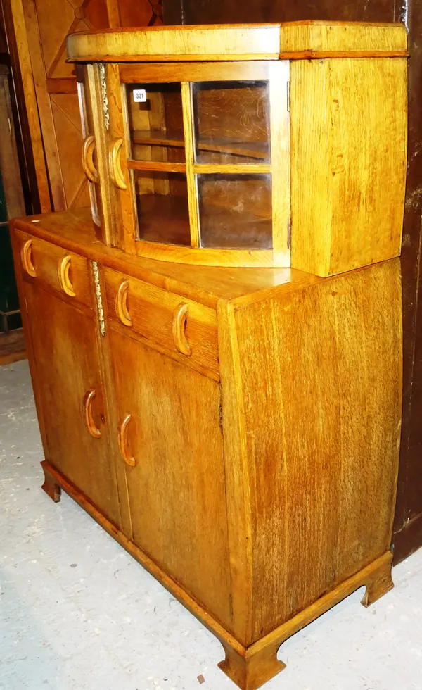 A mid-20th century oak sideboard, with glazed upper section over drawers and cupboards, 102cm wide.  K8