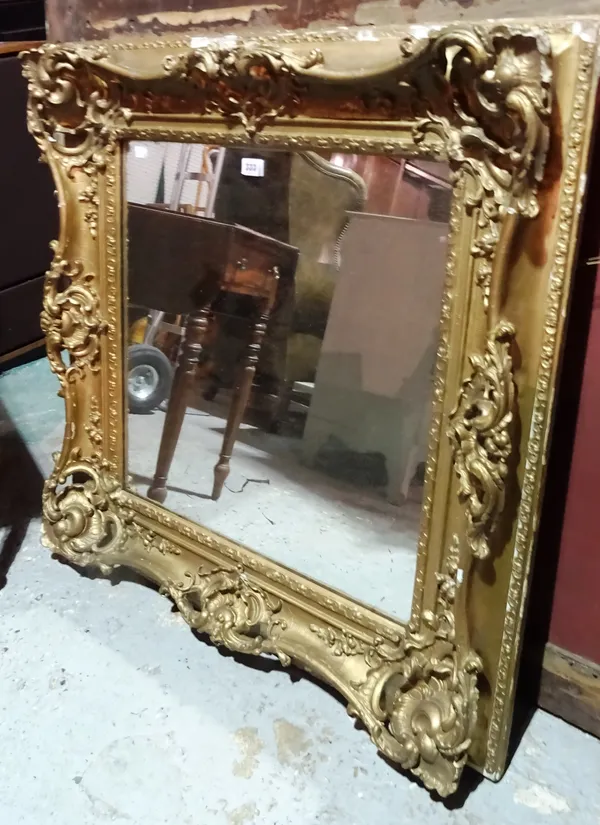 A Victorian gilt framed wall mirror, with relief moulded frame, the glass later, 91cm wide x 91cm high.  M5