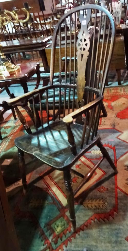 A 20th century ash and elm wheelback Windsor open armchair.  E5