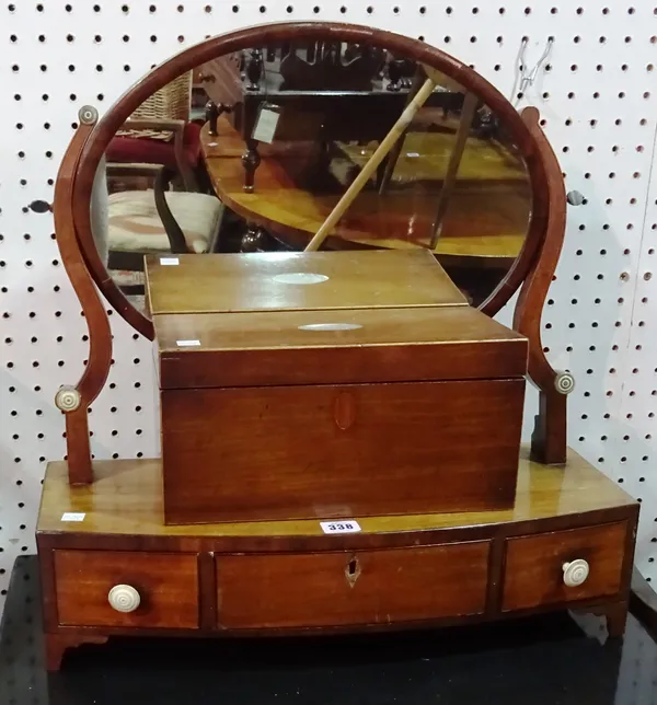 A George III mahogany oval toilet mirror,on a bowfronted base over three frieze drawers, 52cm wide x 53cm high and a Victorian mahogany rectangular te