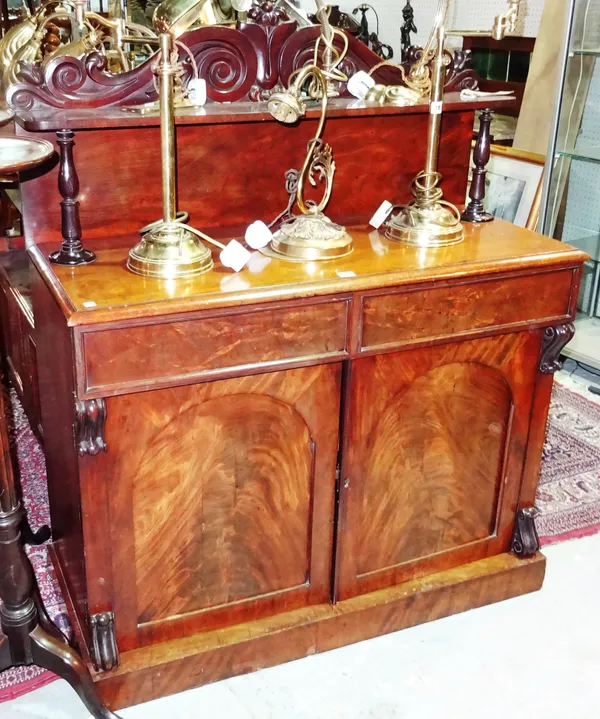 A Victorian mahogany chiffonier with carved top rail and scroll decoration, 111cm wide x 132cm high.  G8
