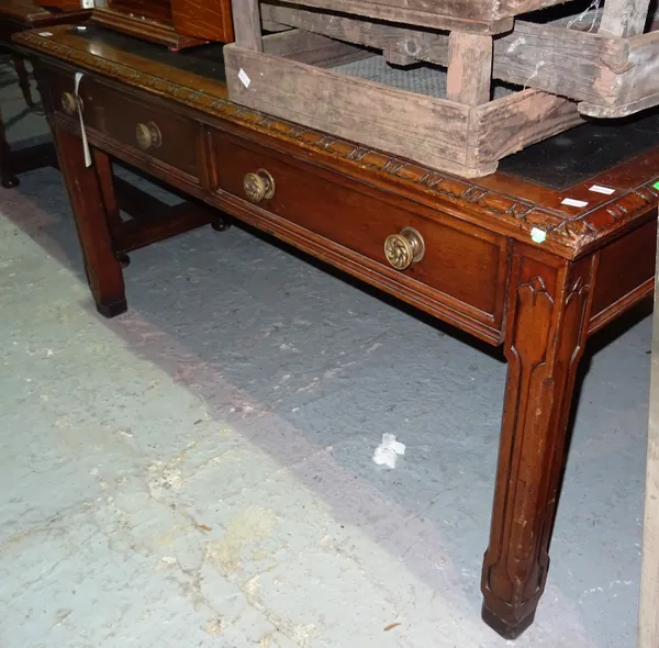 A Gothic Revival mahogany and walnut writing desk, on square block supports, 150cm wide x 78cm high.  G2