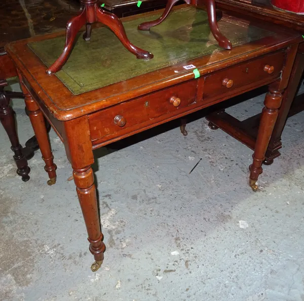 A Victorian mahogany two drawer writing table, with green leather top, on tapering turned supports, 88cm wide x 72cm high.  G4