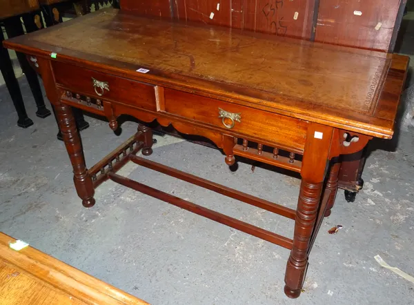 An Edwardian mahogany writing desk with brown leather inset top, on ring turned supports, 122cm wide x 71cm high.  K4