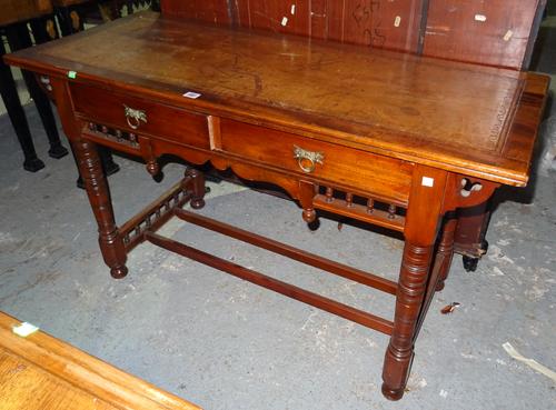 An Edwardian mahogany writing desk with brown leather inset top, on ring turned supports, 122cm wide x 71cm high.  K4