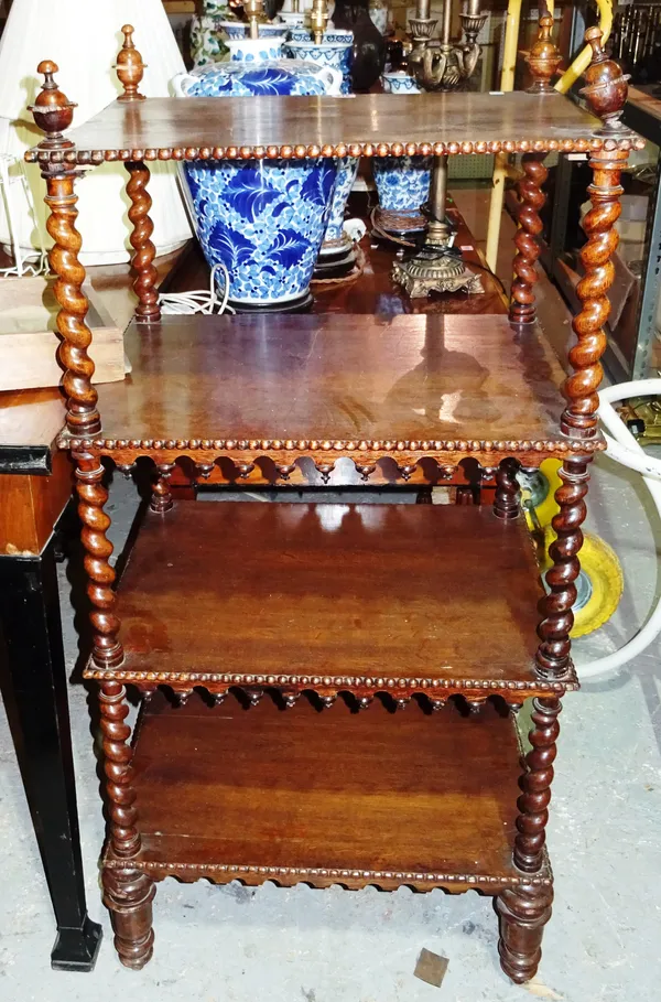 A George IV oak four tier what-not, with barleytwist uprights and split bobbin mounts, on turned supports, 61cm wide x 128cm high.  J4