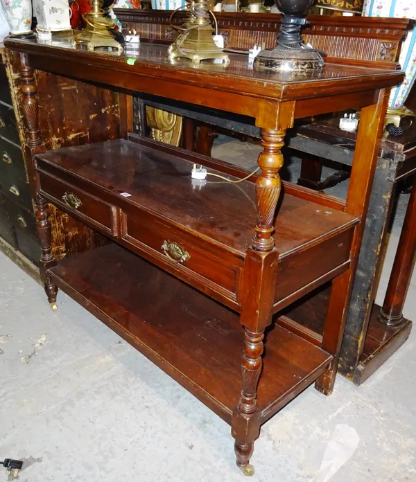 A late 19th century mahogany three tier buffet, with two drawers, on reeded turned supports, 121cm wide x 119cm high.  J2