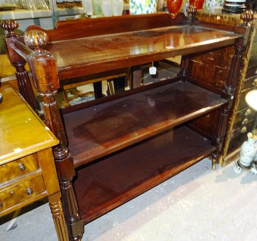An early 19th century mahogany three tier buffet, on reeded turned supports, 120cm wide x 109cm high.  J3