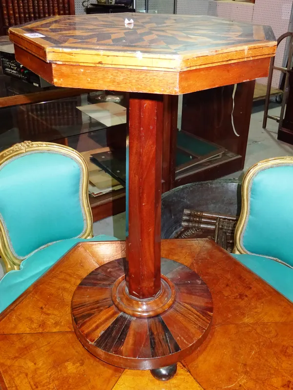 A William IV style octagonal occasional table with specimen wood top, on an octagonal column and circular podium base, 42cm wide x 72cm high.  D3