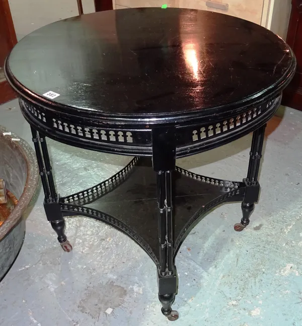 A Chippendale style ebonised circular occasional table, on cluster column supports, 73cm wide x 75cm high.  D3