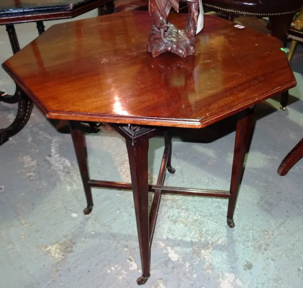 James Shoolbred; a mahogany octagonal occasional table, on canted square supports, 72cm wide x 74cm high.  F3