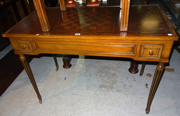 A Victorian mahogany rectangular games table, on reeded turned supports 109cm wide x 98cm high.  K2