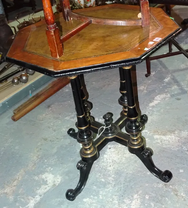 A Victorian satinwood and ebonised octagonal centre table, with leather inset top, 73cm wide x 78cm high.  F3
