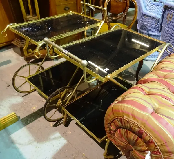A pair of 20th century brass and glass two tier trolleys, (2).  I8