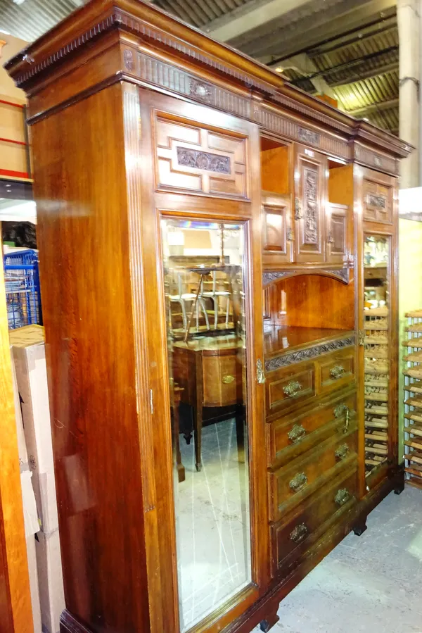 An Edwardian mahogany triple section compactum wardrobe, 230cm wide x 206cm high.  M6