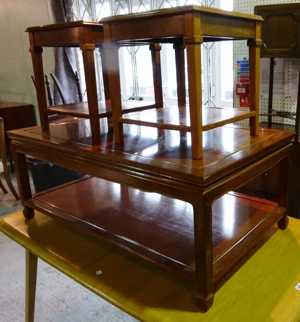 A 20th century Chinese hardwood coffee table with undertier, 104cm wide x 42cm high and a pair of small coffee tables 39cm wide x 42cm high, (3).  B8