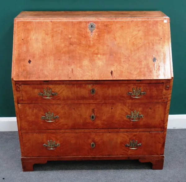 An 18th century Continental mahogany bureau with fitted interior over three long graduated drawers, bracket feet, 108cm wide x 112cm wide x 51cm deep.