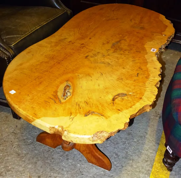 A 20th century oak coffee table of naturalistic form, 116cm wide x 41cm high.  DIS