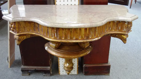 An 18th century style wall mounted console, the serpentine marble top on a pair of gilt eagle head supports, 78cm wide x 61cm high x 45cm deep.  J6