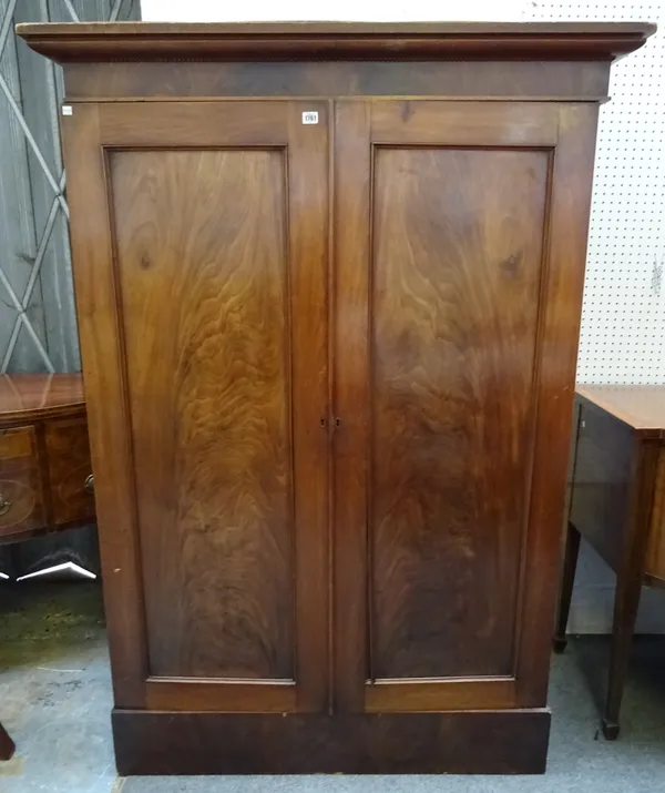A Victorian mahogany two door wardrobe on plinth base, of small proportions, 125cm wide x 58cm deep x 179cm high.  K8