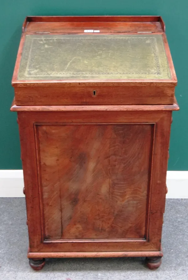 An early 19th century mahogany slide top Davenport, with four side drawers,55cm wide x 49cm deep x 89cm high.  I6