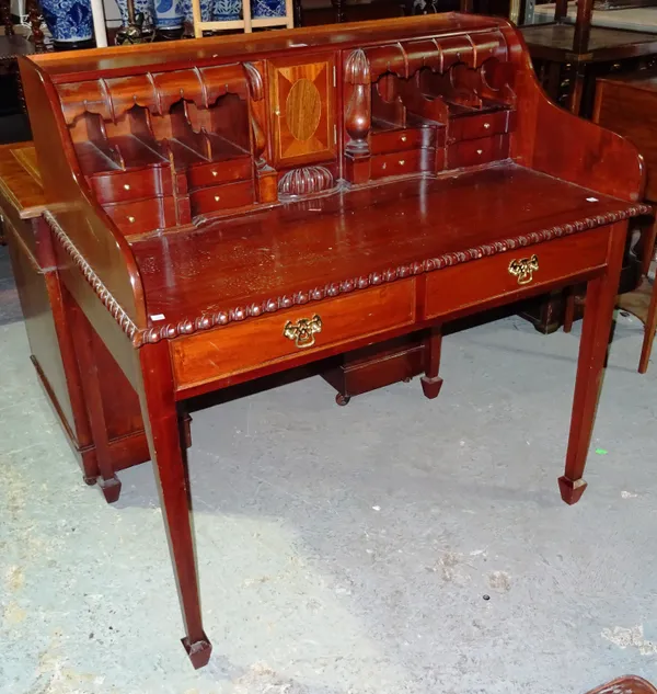 A 20th century mahogany writing desk with fitted galleried back and gadrooned moulding, 103cm wide x 105cm high.  I4