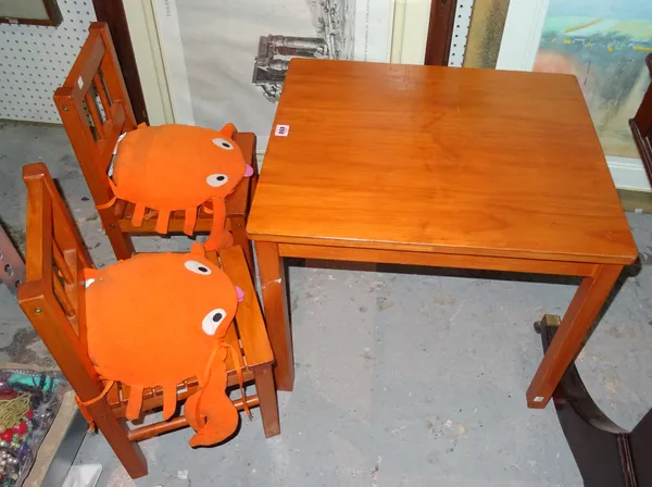Children's furniture, comprising; a 20th century stained pine dining table, 59cm wide x 51cm high, and two bar back chairs, (3).  K2